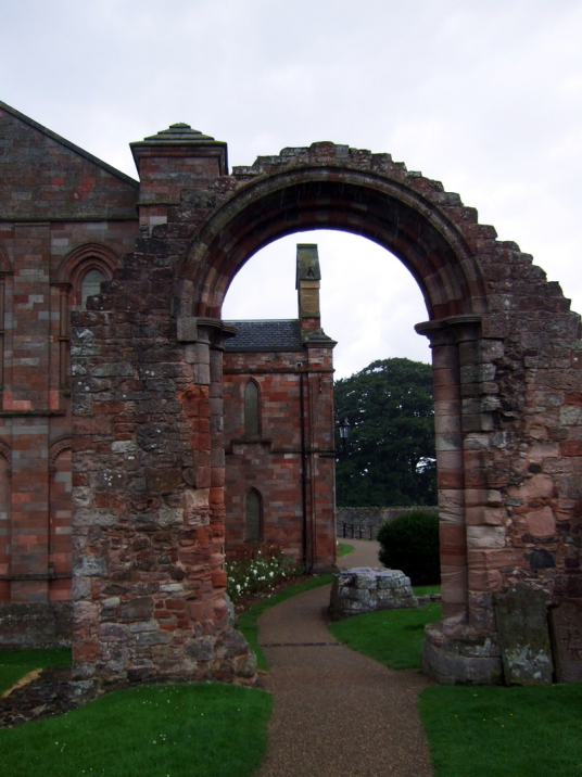 Transept arch of Coldingham Priory, now used as the parish church, in the interesting graveyard with many old memorials in the scenic village of Coldingham